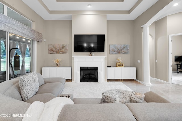 1071 Green Pine Cir, Orange Park, FL 32065 - living room with decorative columns, a fireplace with flush hearth, and baseboards