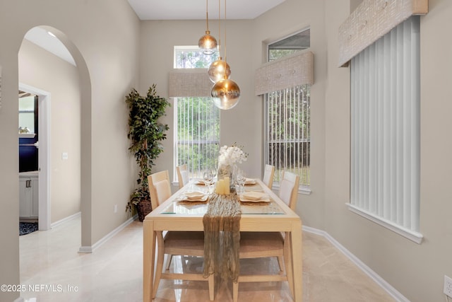 1071 Green Pine Cir, Orange Park, FL 32065 - dining room featuring arched walkways and baseboards