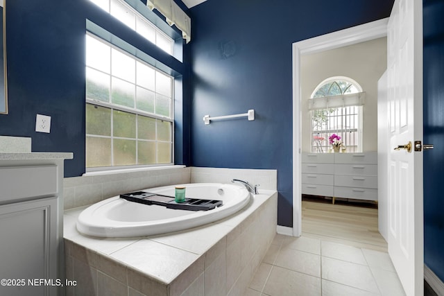 1071 Green Pine Cir, Orange Park, FL 32065 - bathroom featuring vanity, a garden tub, and tile patterned flooring