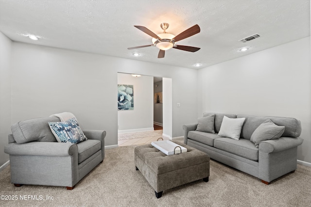 living area featuring visible vents, recessed lighting, a ceiling fan, and carpet flooring