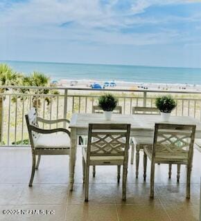 1415 1st St N Unit 302, Jacksonville Beach, FL 32250 - balcony featuring view of water and beach and outdoor dining area