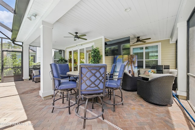 view of patio / terrace with outdoor dining area, ceiling fan, and outdoor lounge area
