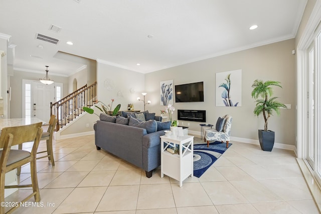 living area with light tile patterned flooring, visible vents, recessed lighting, and stairway