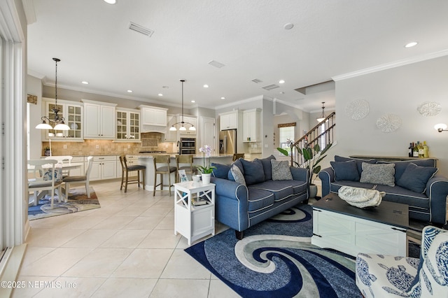 living area featuring stairway, recessed lighting, light tile patterned flooring, and visible vents