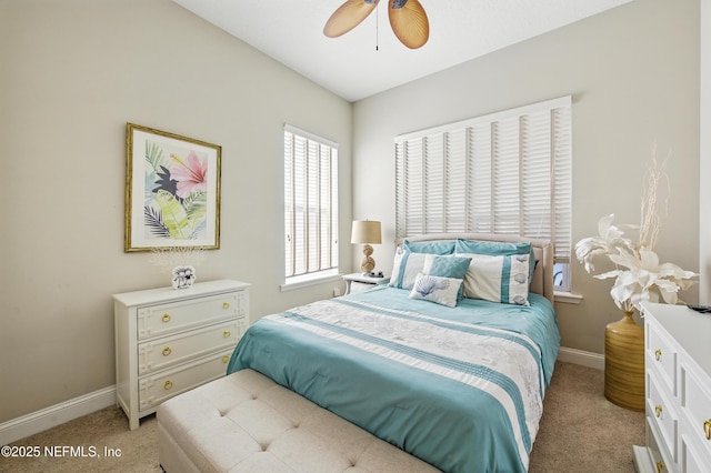 bedroom with baseboards, light carpet, and ceiling fan