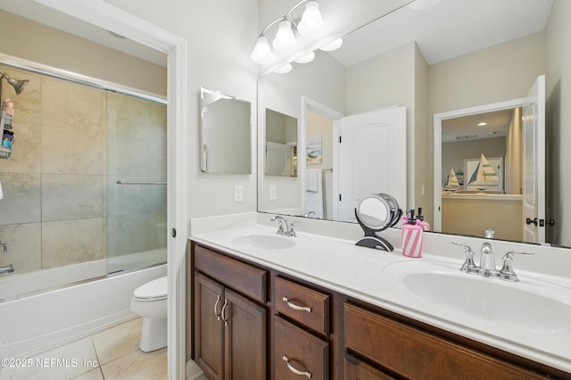 bathroom with a sink, tile patterned floors, enclosed tub / shower combo, and double vanity