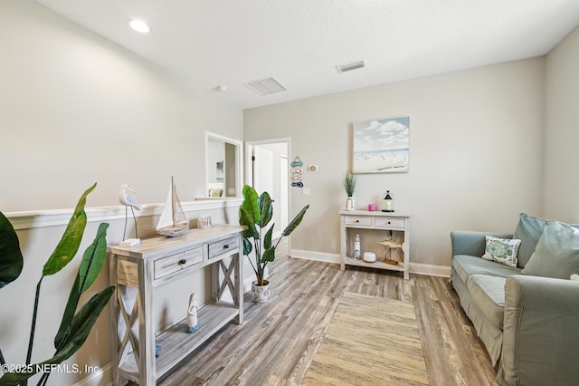 office featuring light wood-style floors, recessed lighting, baseboards, and visible vents
