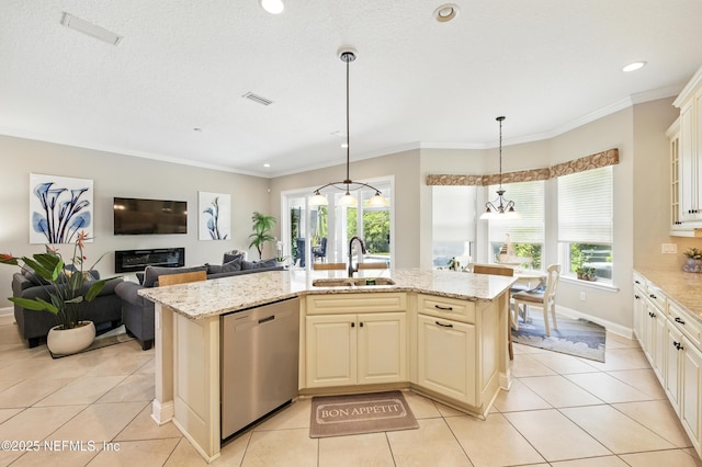 kitchen with stainless steel dishwasher, light tile patterned flooring, plenty of natural light, and a sink
