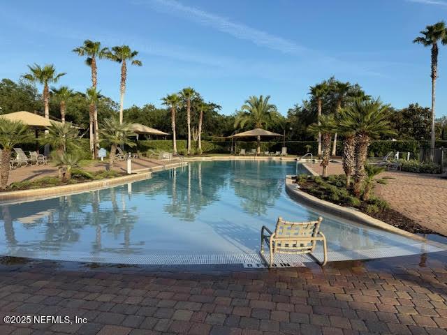 pool with a patio