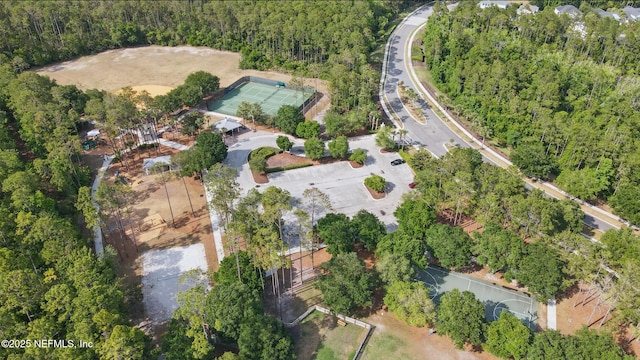 aerial view featuring a wooded view