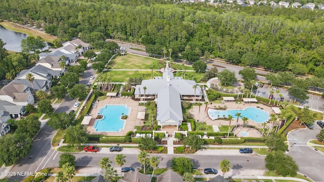 drone / aerial view with a view of trees
