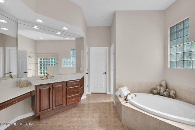 bathroom featuring a bath, tile patterned flooring, a shower, vanity, and recessed lighting