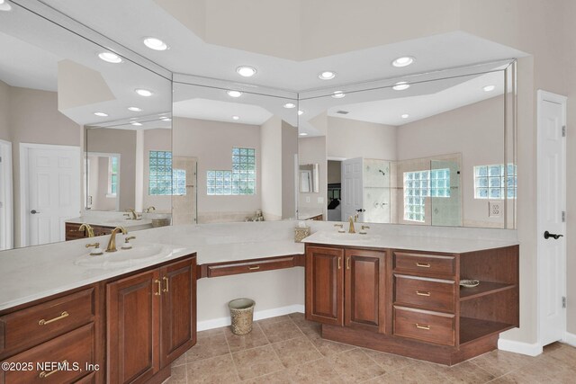 bathroom featuring vanity, tile patterned floors, walk in shower, and recessed lighting