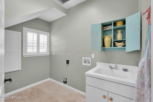 laundry room featuring baseboards, cabinet space, electric dryer hookup, a sink, and washer hookup