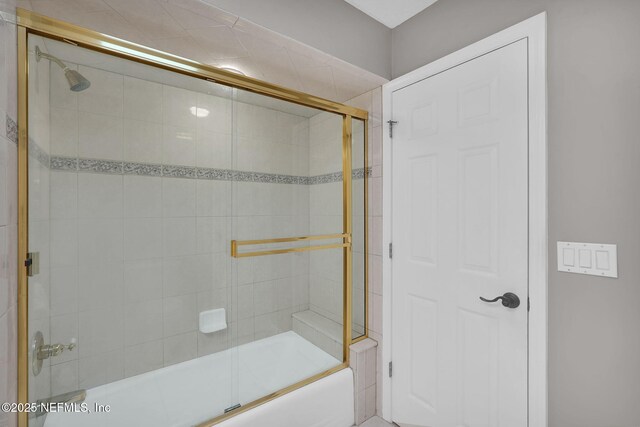 full bathroom with combined bath / shower with glass door