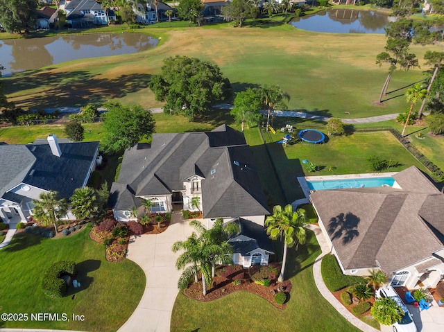 aerial view with a water view, view of golf course, and a residential view