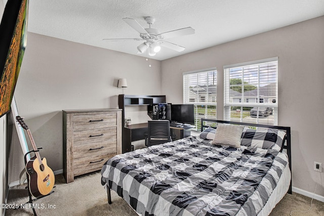 bedroom with baseboards, carpet, and ceiling fan