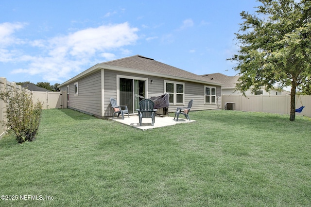 back of house with a fenced backyard, a patio area, a yard, and cooling unit