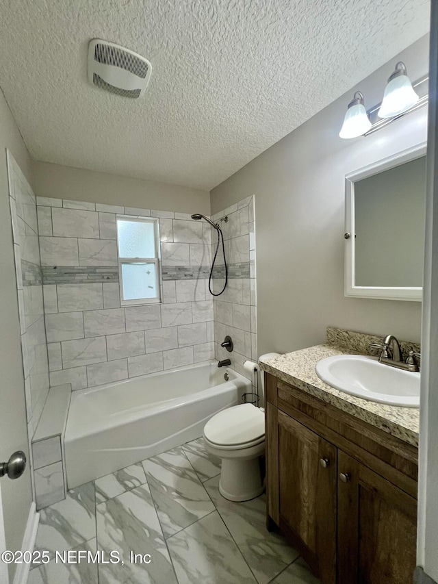 bathroom with a textured ceiling, visible vents, shower / tub combination, toilet, and marble finish floor