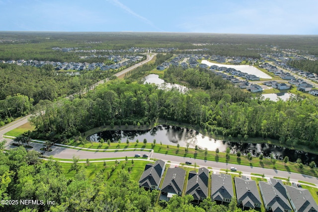 drone / aerial view featuring a residential view and a water view
