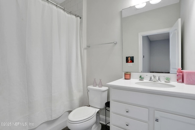 bathroom with toilet and vanity