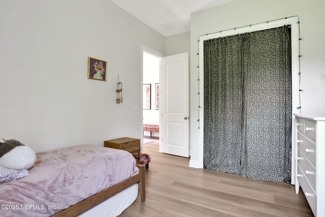 bedroom with light wood-style flooring