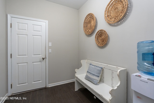 entrance foyer featuring dark wood-style floors and baseboards