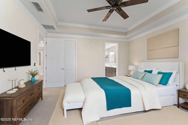 64 Nevis Peak Ln, Saint Augustine, FL 32092 - bedroom with light carpet, ornamental molding, a tray ceiling, ensuite bath, and a ceiling fan