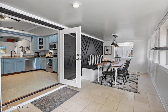 2681 Kimberly Forest Dr E, Jacksonville, FL 32246 - dining area featuring light tile patterned floors, french doors, and baseboards