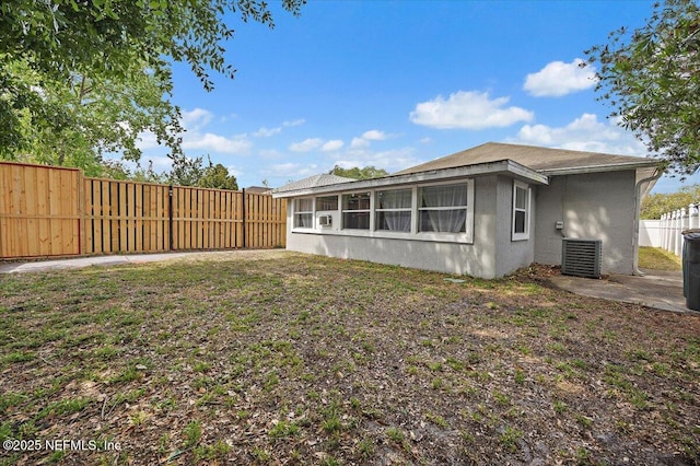 2681 Kimberly Forest Dr E, Jacksonville, FL 32246 - rear view of property with stucco siding, a fenced backyard, and cooling unit
