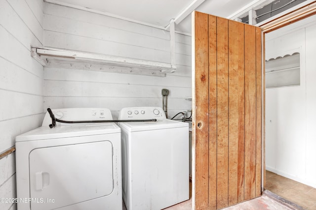 laundry room featuring washing machine and clothes dryer and laundry area