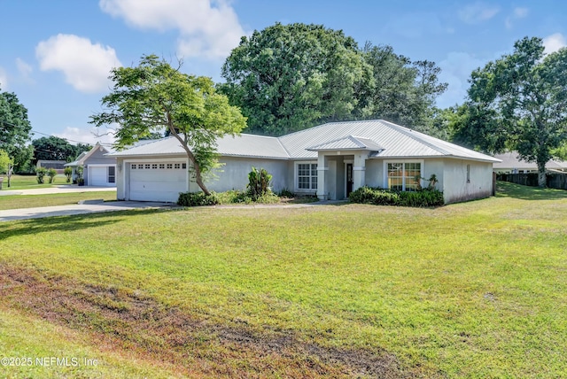 5329 Ogilvie Ln, Saint Augustine, FL 32086 - ranch-style home with concrete driveway, an attached garage, metal roof, and a front lawn
