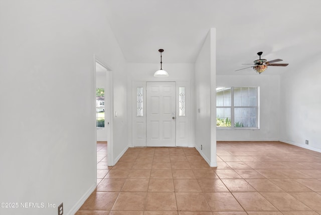 5329 Ogilvie Ln, Saint Augustine, FL 32086 - entrance foyer with ceiling fan, plenty of natural light, and light tile patterned floors
