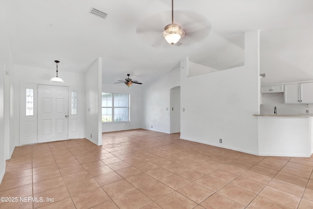 5329 Ogilvie Ln, Saint Augustine, FL 32086 - entryway with a ceiling fan, visible vents, arched walkways, light tile patterned floors, and lofted ceiling