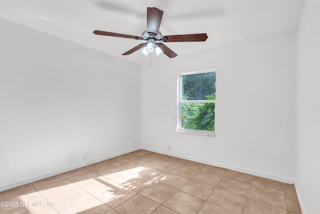 5329 Ogilvie Ln, Saint Augustine, FL 32086 - empty room featuring light tile patterned floors, baseboards, and ceiling fan