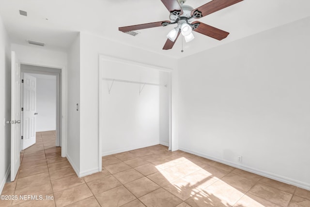 5329 Ogilvie Ln, Saint Augustine, FL 32086 - unfurnished bedroom featuring light tile patterned flooring, a ceiling fan, visible vents, and a closet