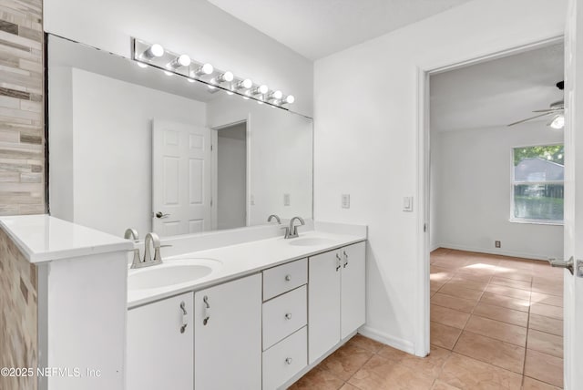 5329 Ogilvie Ln, Saint Augustine, FL 32086 - bathroom featuring double vanity, ceiling fan, a sink, and tile patterned flooring