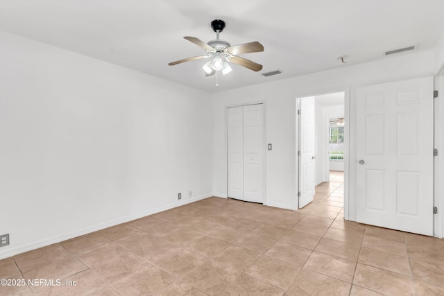 5329 Ogilvie Ln, Saint Augustine, FL 32086 - unfurnished bedroom featuring visible vents, baseboards, light tile patterned floors, and a closet