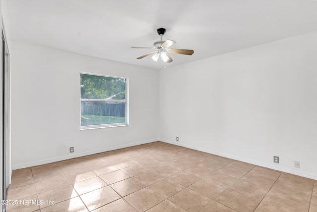 5329 Ogilvie Ln, Saint Augustine, FL 32086 - empty room featuring light tile patterned floors, baseboards, and ceiling fan