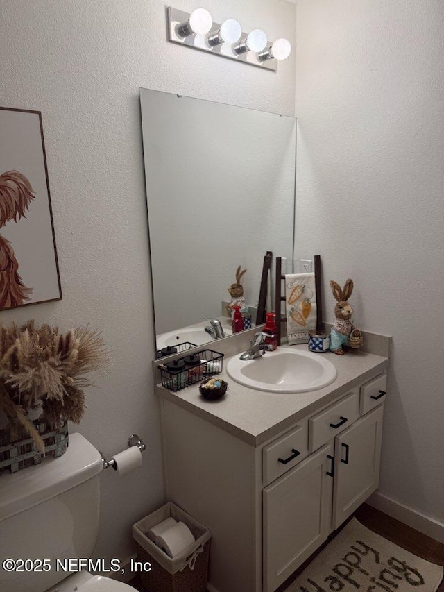half bath with toilet and vanity