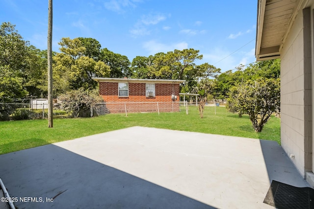 view of patio featuring fence
