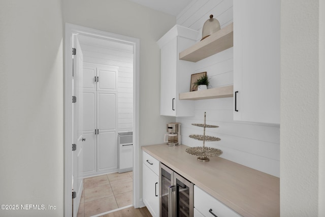 office featuring beverage cooler and a bar