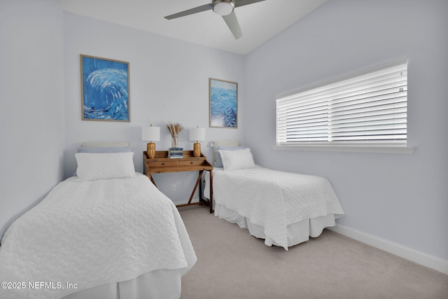 carpeted bedroom featuring baseboards and ceiling fan
