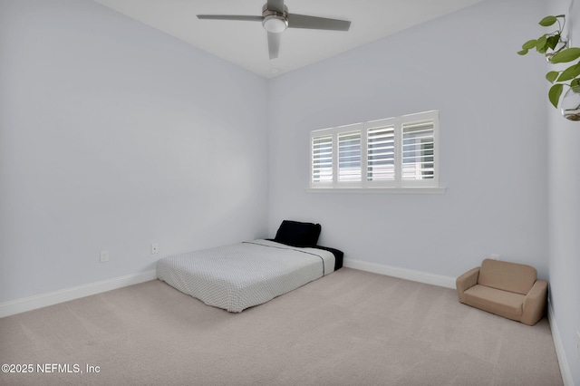 carpeted bedroom with baseboards and ceiling fan