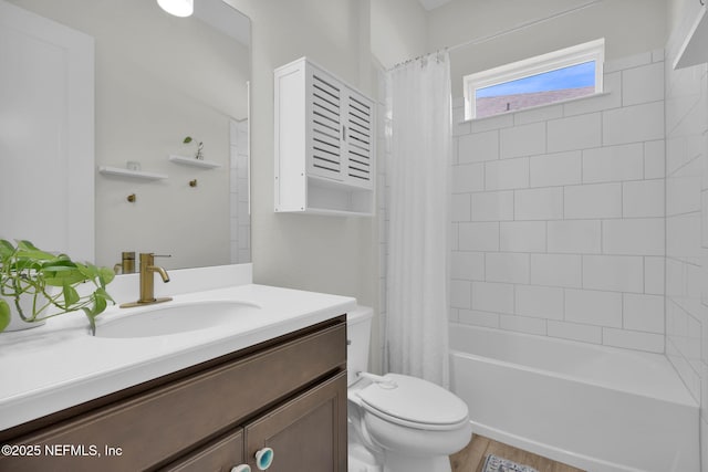full bath featuring vanity, shower / bath combo with shower curtain, and toilet