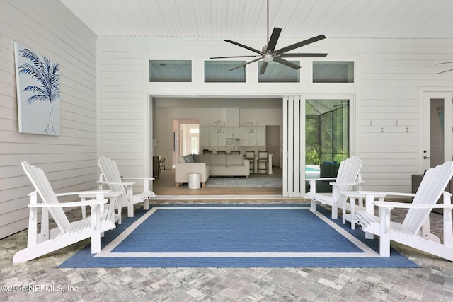 view of patio / terrace with ceiling fan and a deck