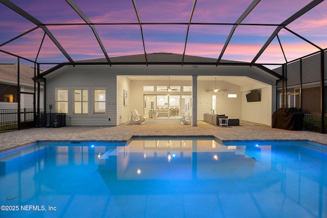 outdoor pool featuring a patio, ceiling fan, outdoor lounge area, and a lanai