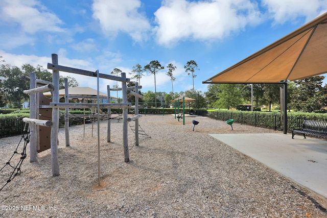 view of home's community with fence and playground community