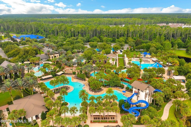 aerial view featuring a wooded view