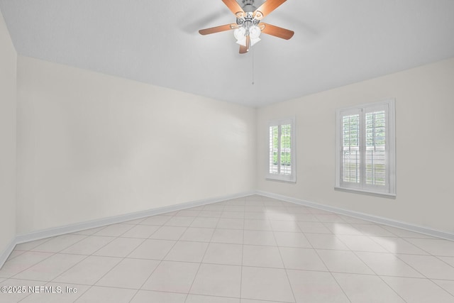 empty room with baseboards and ceiling fan